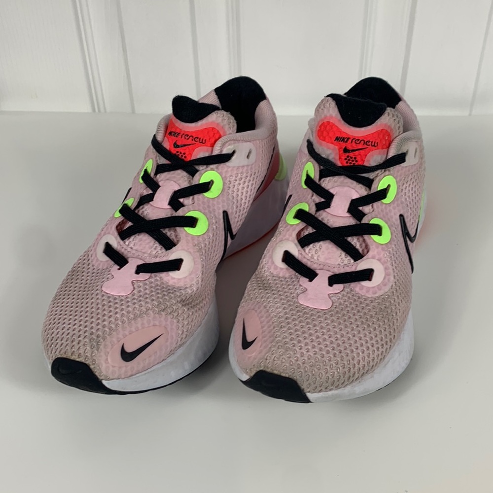 Nike Renew pink athletic shoes with neon green accents. Size ladies 5.